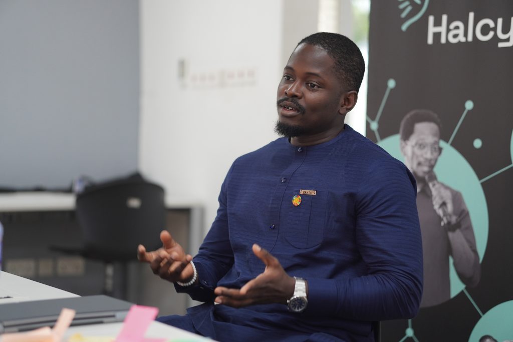Entrepreneur in a solar-powered cold storage facility in Nigeria, symbolizing the choice to chose Nigeria over foreign offers