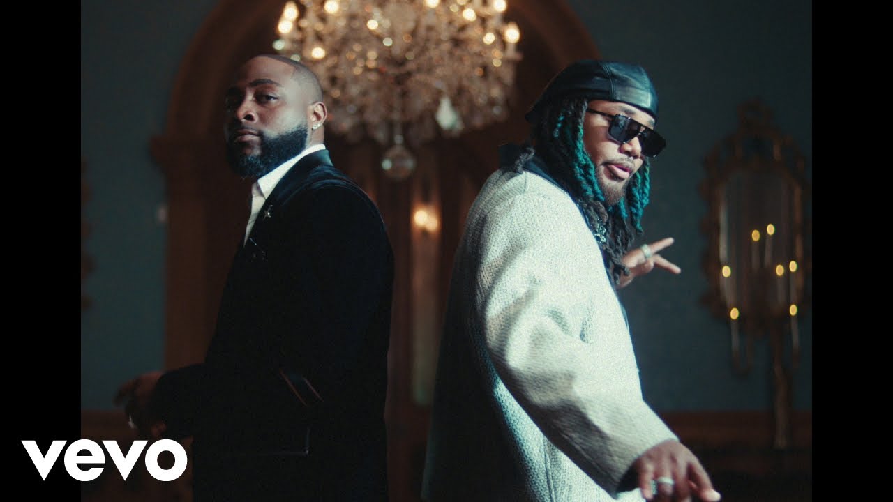 Romantic scene from Davido and Leon Thomas’s music video for “Tell Everybody,” showcasing love in music against a Lagos Lagoon sunset