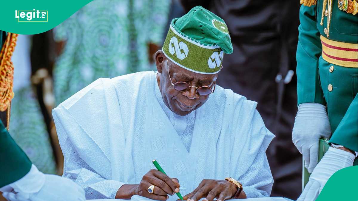 Nigerian and American flags on a table with a gavel, symbolizing legal proceedings and international relations.
