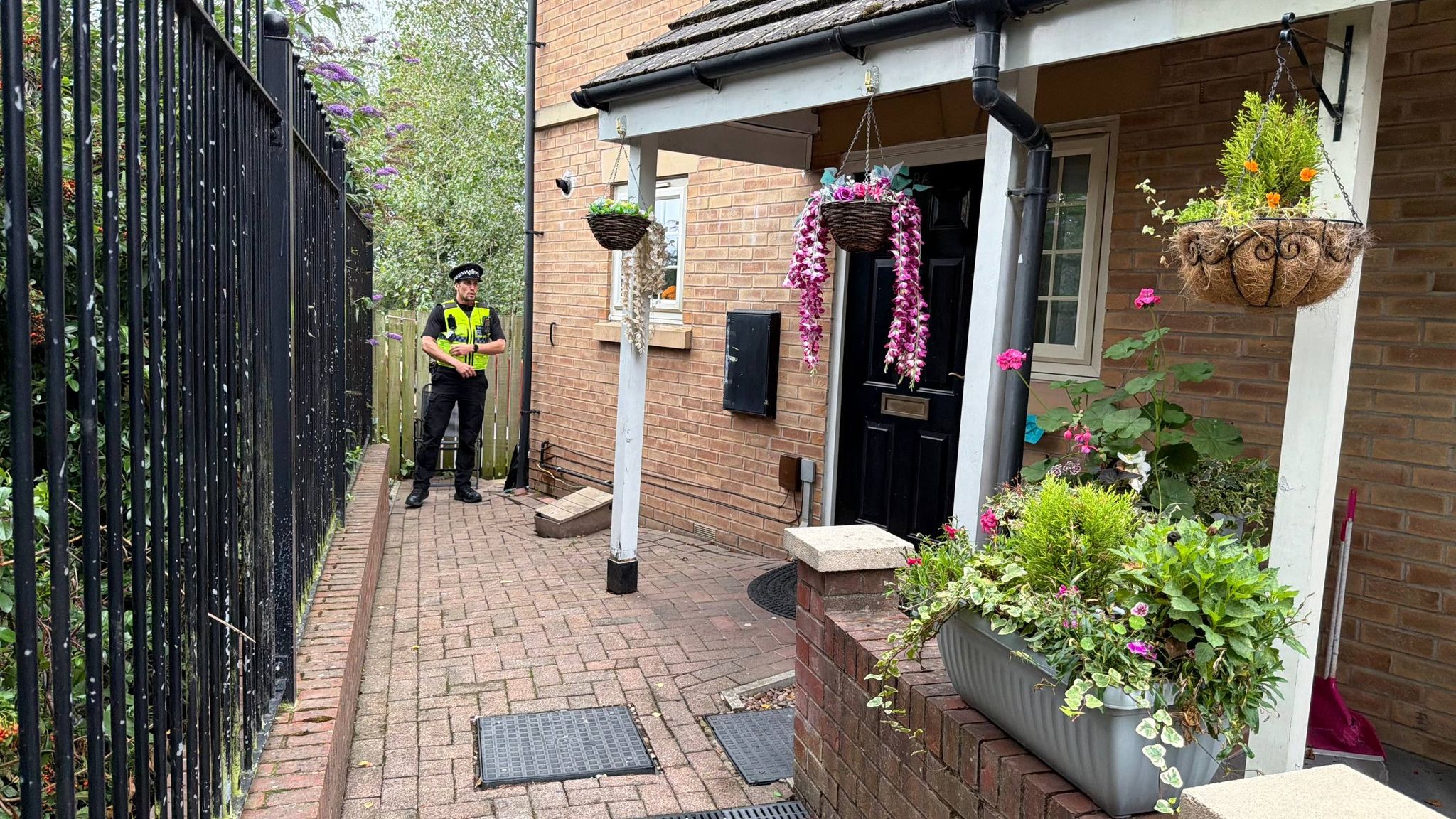 A police cordon tape outside a residential house in Sheffield, UK, symbolising the investigation into a newborn baby's death.