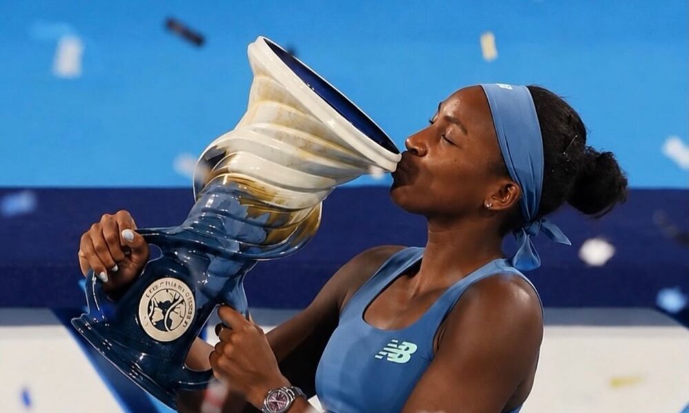A female tennis player in action on a court in Lagos, with Nigerian and African flags waving in the background, symbolizing the rise of African tennis.
