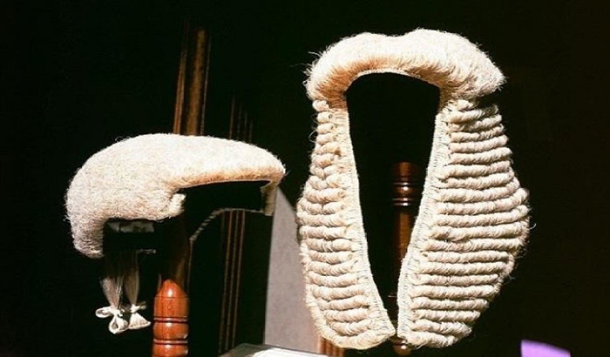 Empty courtroom with wooden benches and judge's bench, symbolising judicial proceedings and potential reform in Nigeria