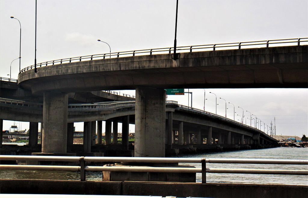 Construction workers and cranes at Carter Bridge in Lagos during the start of the reconstruction project