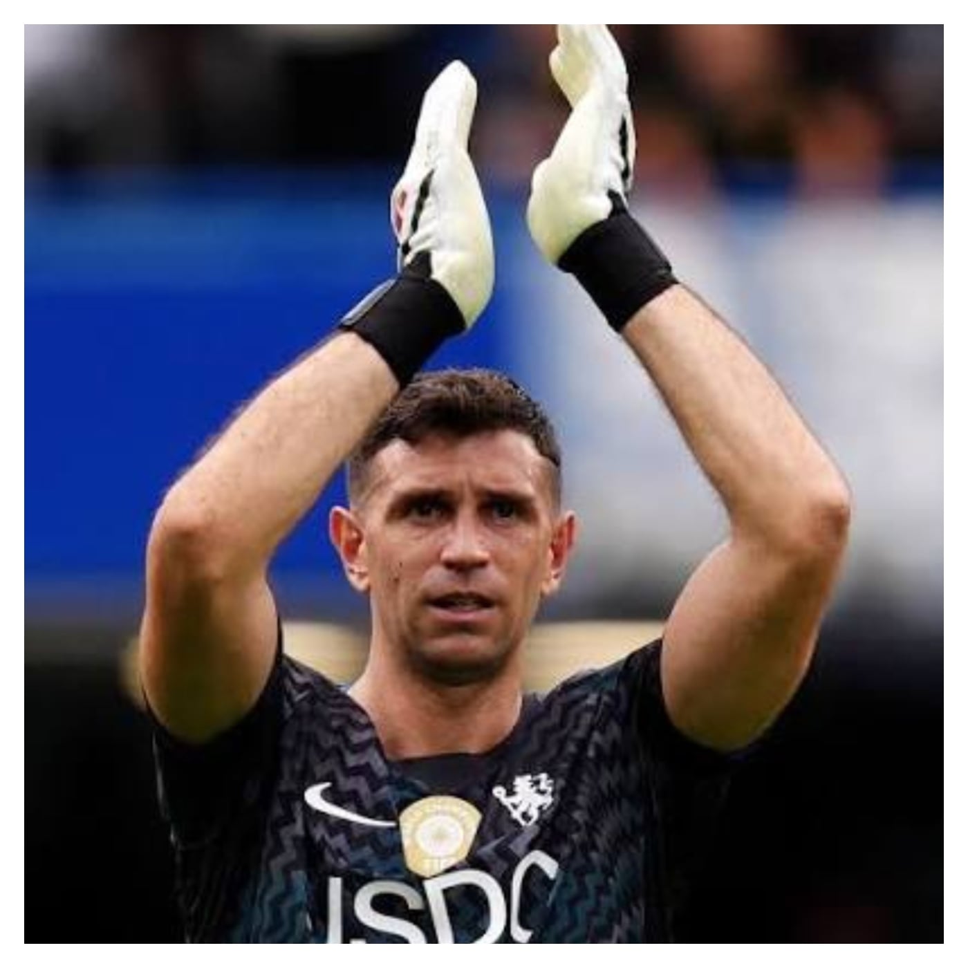 A Chelsea goalkeeper's No. 26 jersey hanging in a Stamford Bridge dressing room, symbolizing the legacy of John Terry.