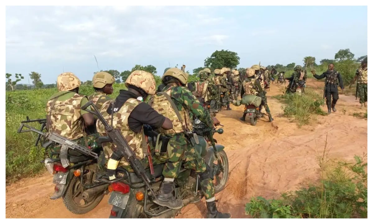 Nigerian soldiers on patrol in Kaura Namoda, Zamfara, carrying a recovered AK-47 rifle during a night operation.