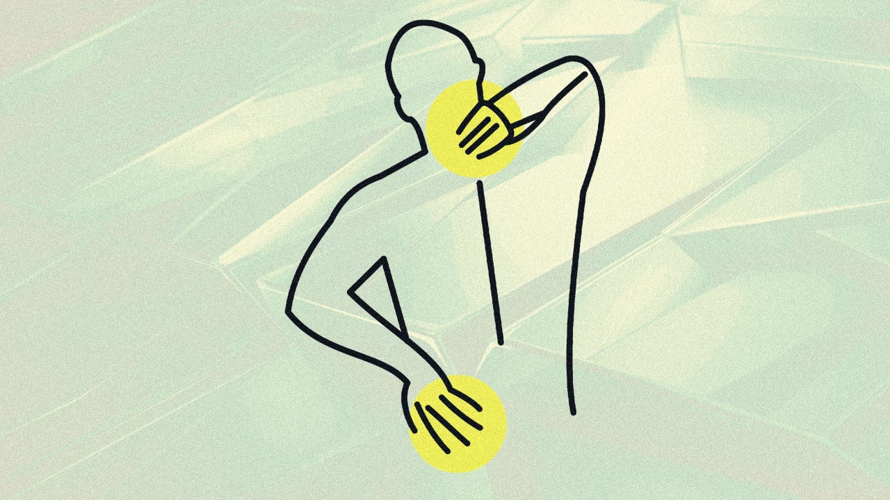 A person sitting on a bed at night, massaging their lower back with a look of relief, in a softly lit bedroom.