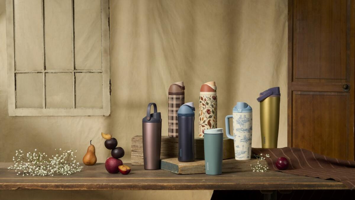 Seven Owala bottles and tumblers in new fall 2026 colors arranged in a circle on a neutral background
