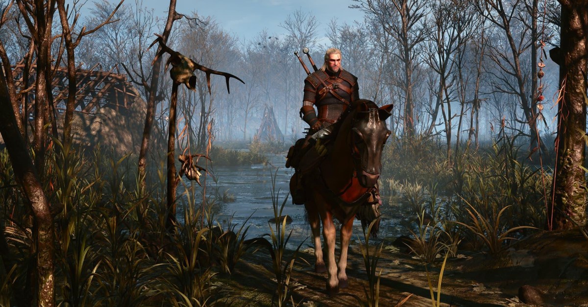 Geralt of Rivia stands in a misty forest, showcasing the enhanced visuals of The Witcher 3 Remastered with improved lighting and textures.