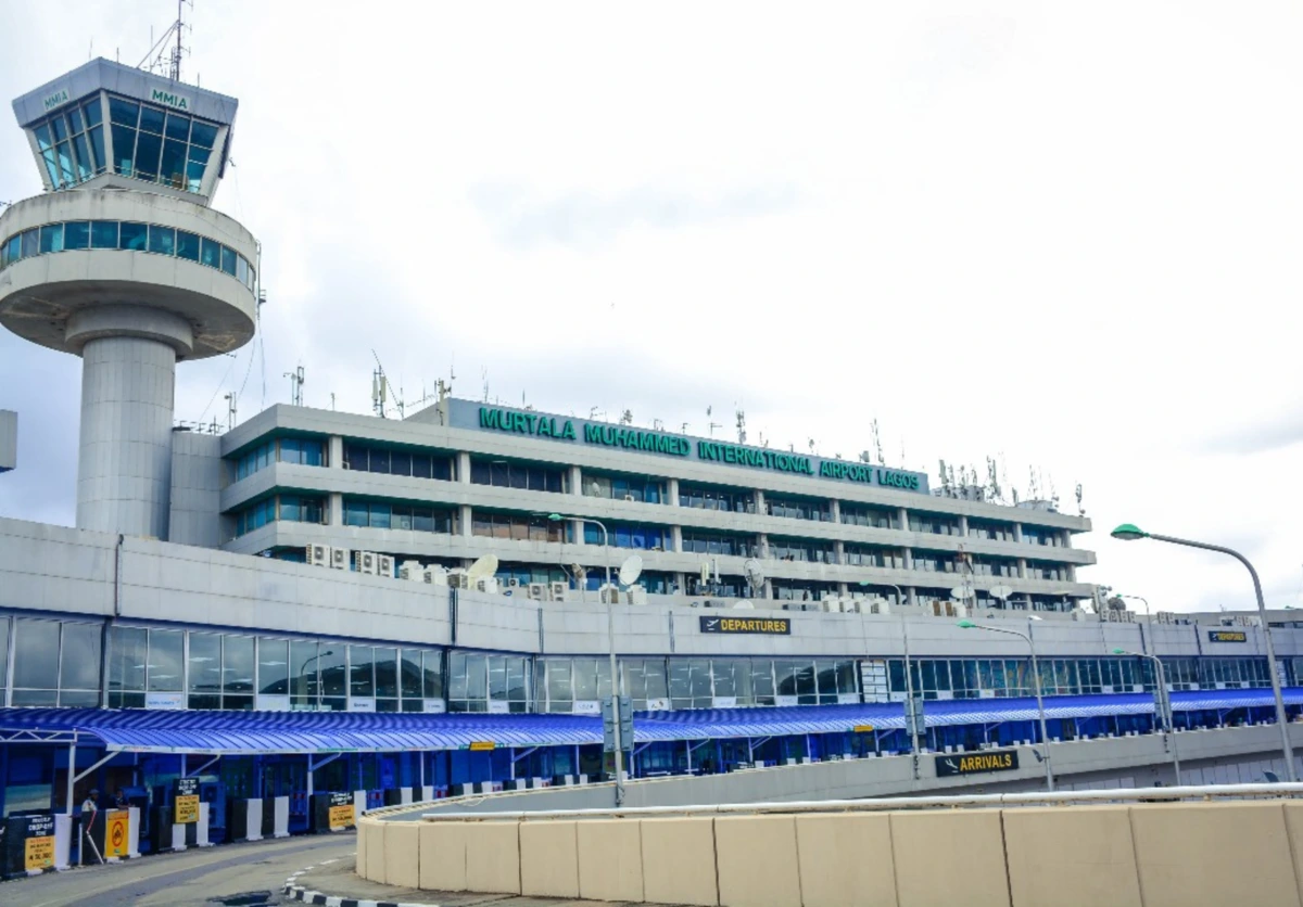 Aerial view of Murtala Muhammed International Airport in Lagos Nigeria with aircraft and city skyline