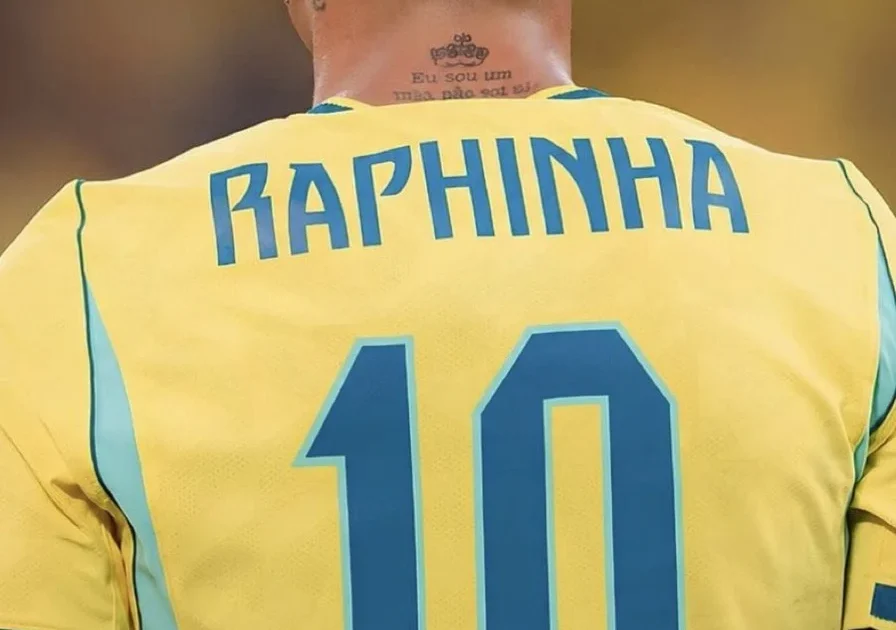 African fans cheering in a stadium as a Brazilian player wearing the No.10 jersey sprints forward.