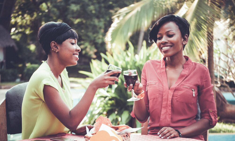 Young Nigerian woman reflecting on self-determination amidst urban environment