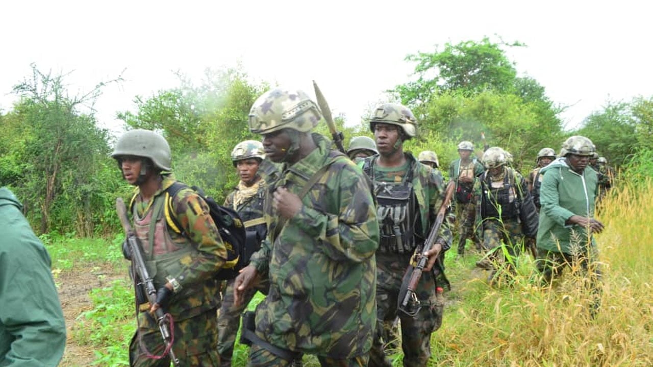 Nigerian troops on guard near a village house in Zamfara at sunrise