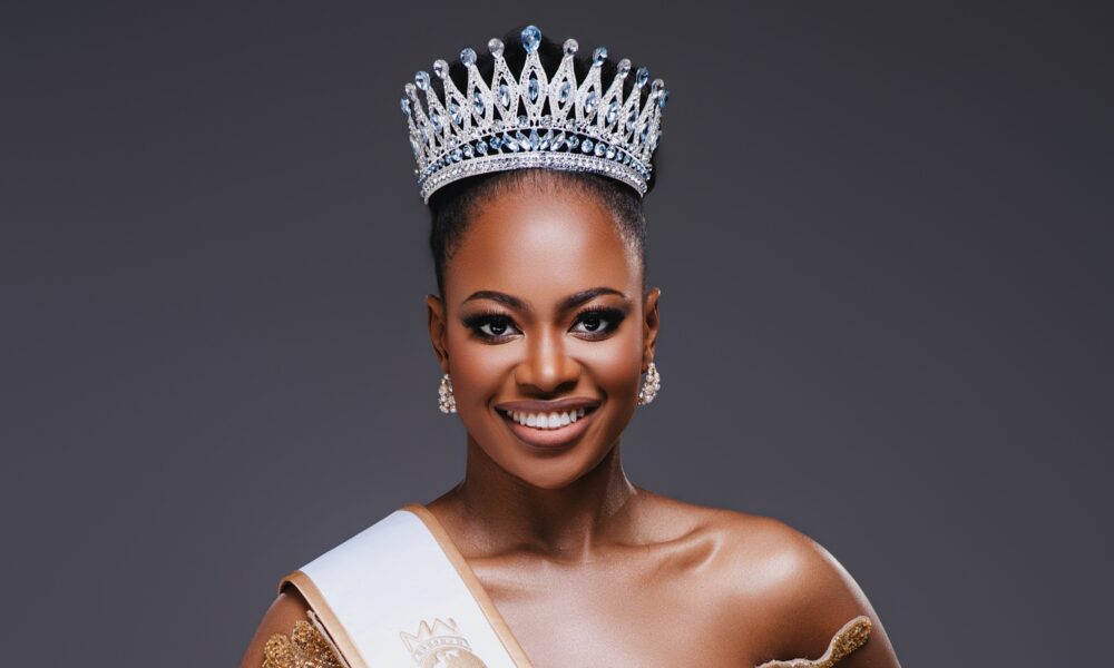 Empty grand pageant stage with a crown on a velvet pedestal, evoking the Miss World Africa 2026 crowning moment.