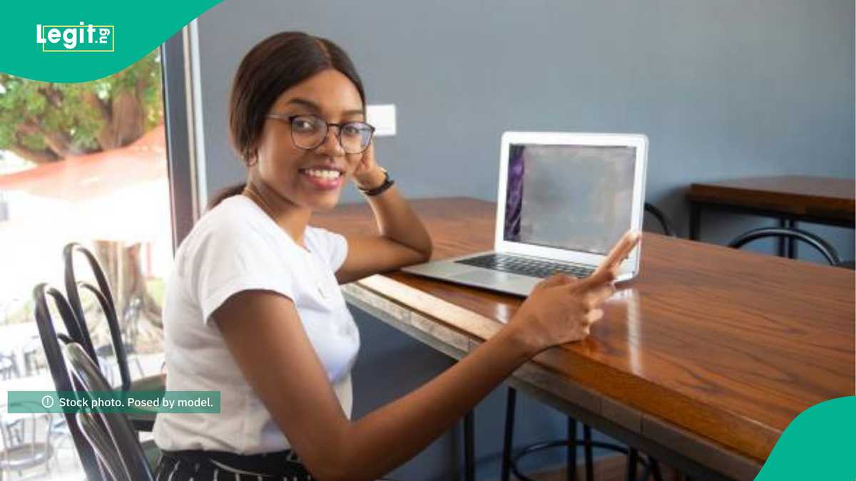 Nigerian lady celebrating after securing a UK university scholarship