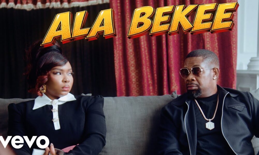 Editorial still from a styled African wedding scene depicting a bride and groom laughing while entertainers perform, capturing the joyful mood of the Yemi Alade and Don Jazzy Ala Bekee music video.