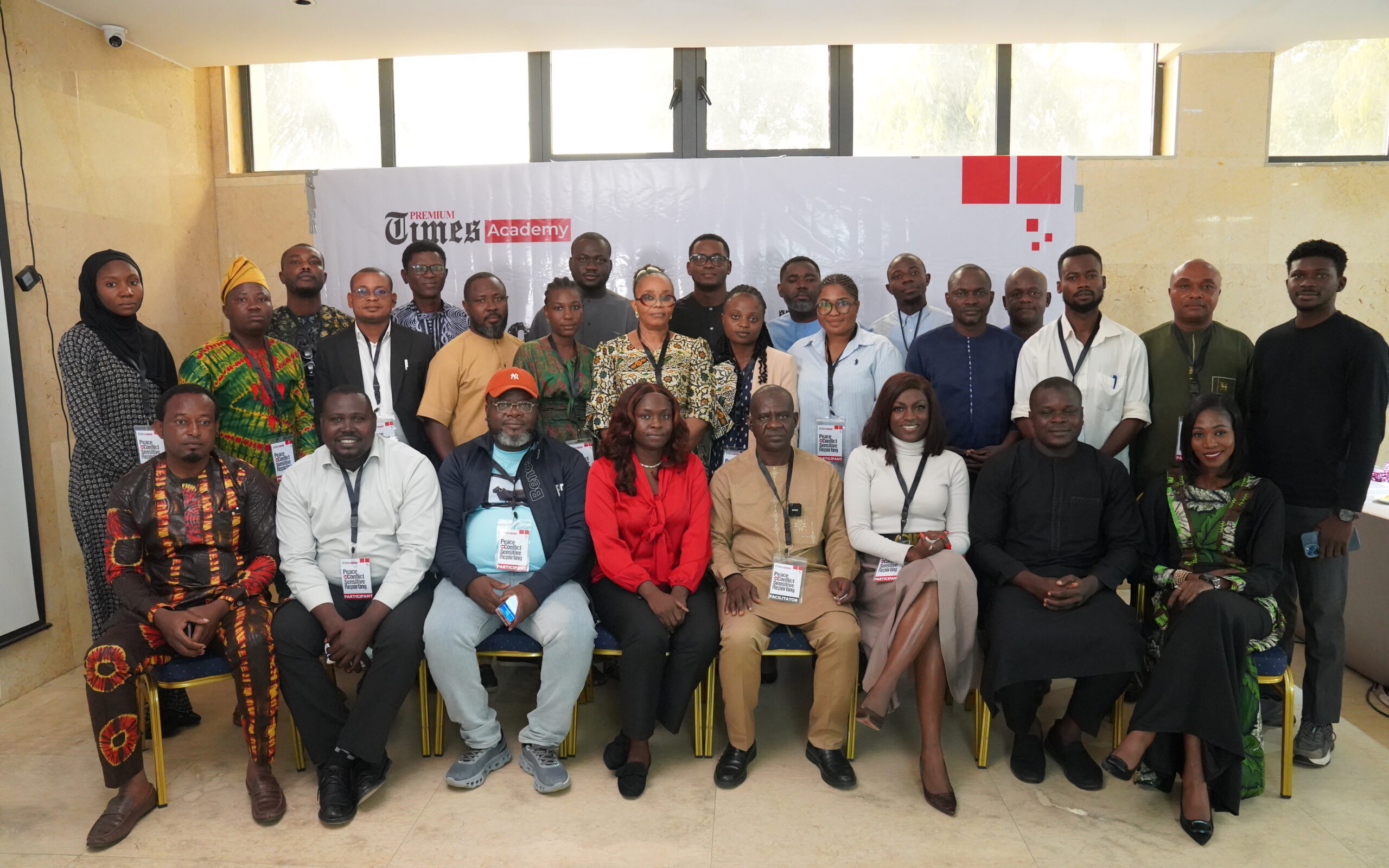Journalists in a Lagos newsroom discussing peace and conflict-sensitive reporting