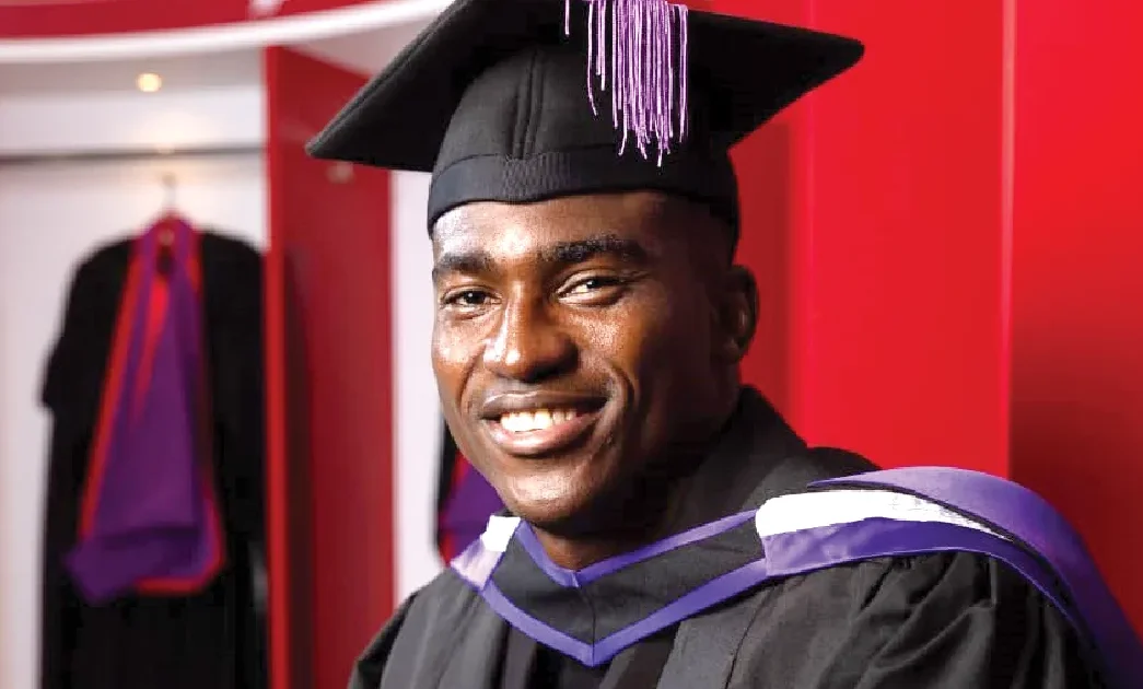 Graduation ceremony at PFA Business School with football-themed backdrop