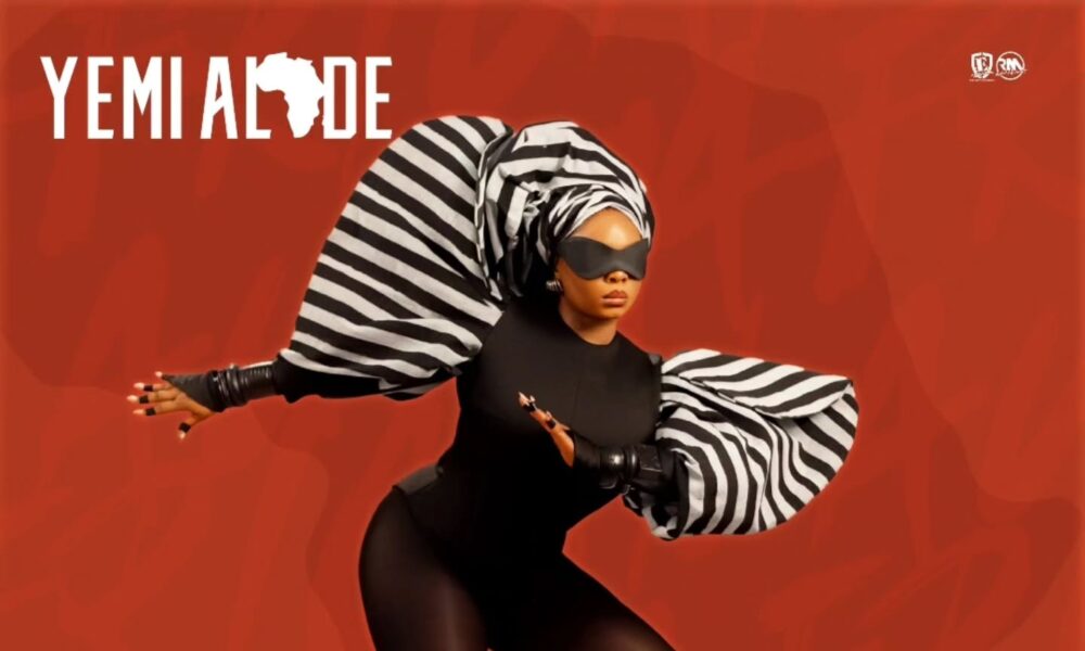 Studio setting with African fabrics and musical instruments representing Yemi Alade’s new album vibe