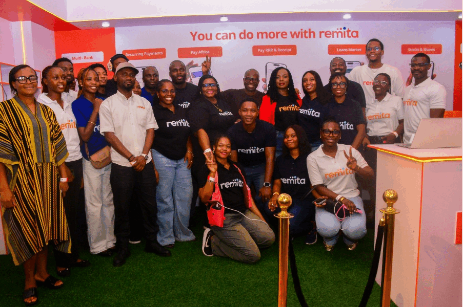 Smartphone displaying Remita mobile app dashboard against a Lagos skyline