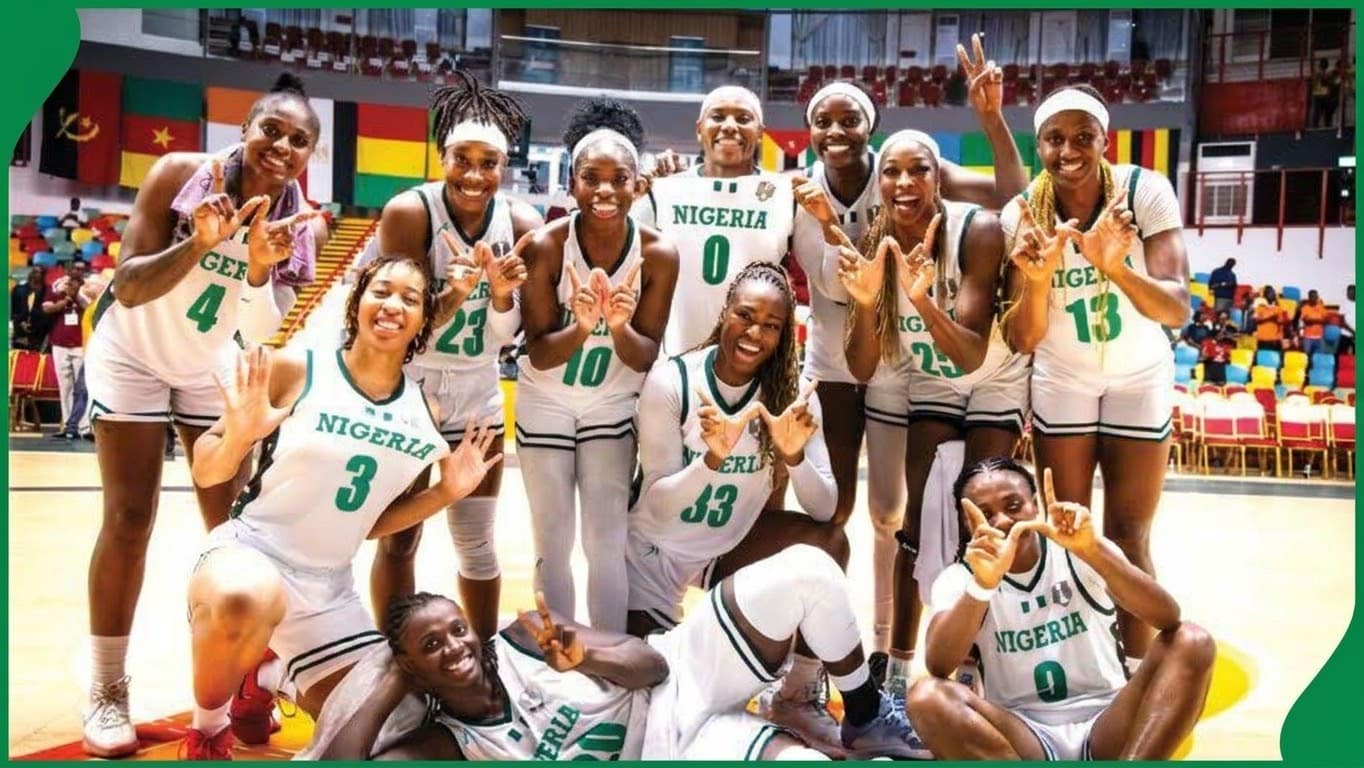 Lagos basketball court with Nigerian flag and trophy, symbolising D’Tigress success