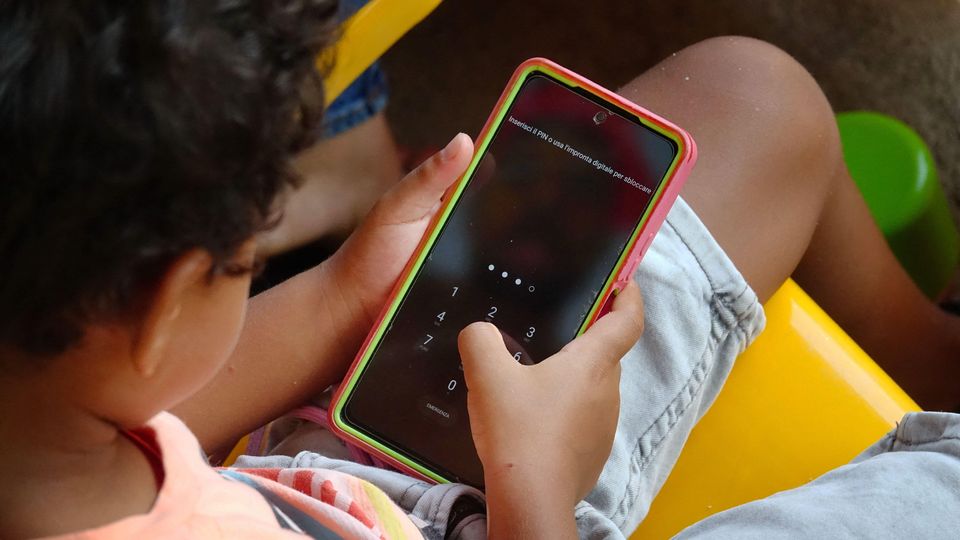 African family concerned about children's screen use in a modern living room