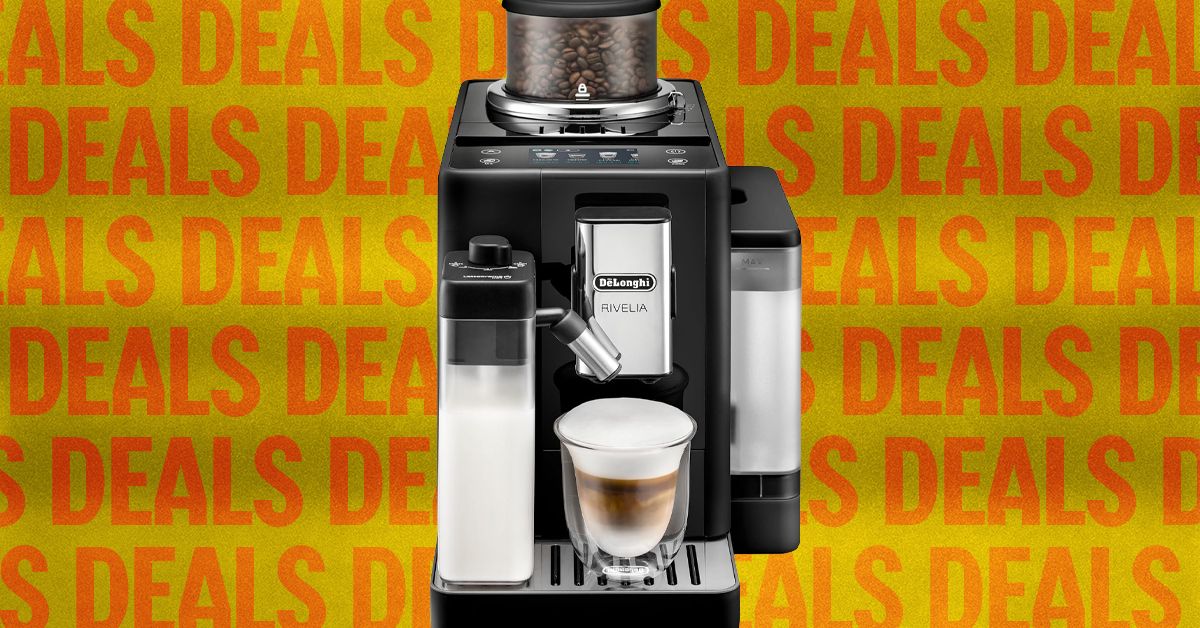 Modern kitchen setup featuring specialty coffee beans, an espresso machine, and a sign promoting the best coffee deals of 2026