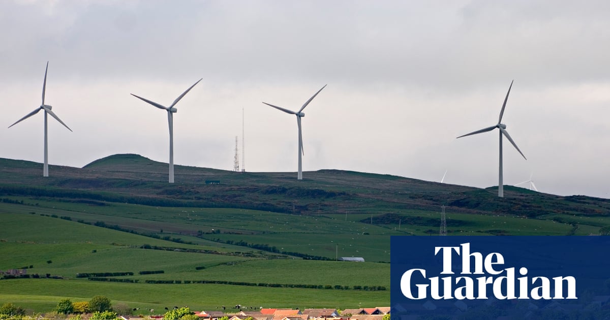 Transmission towers on a countryside backdrop illustrating the UK electricity grid