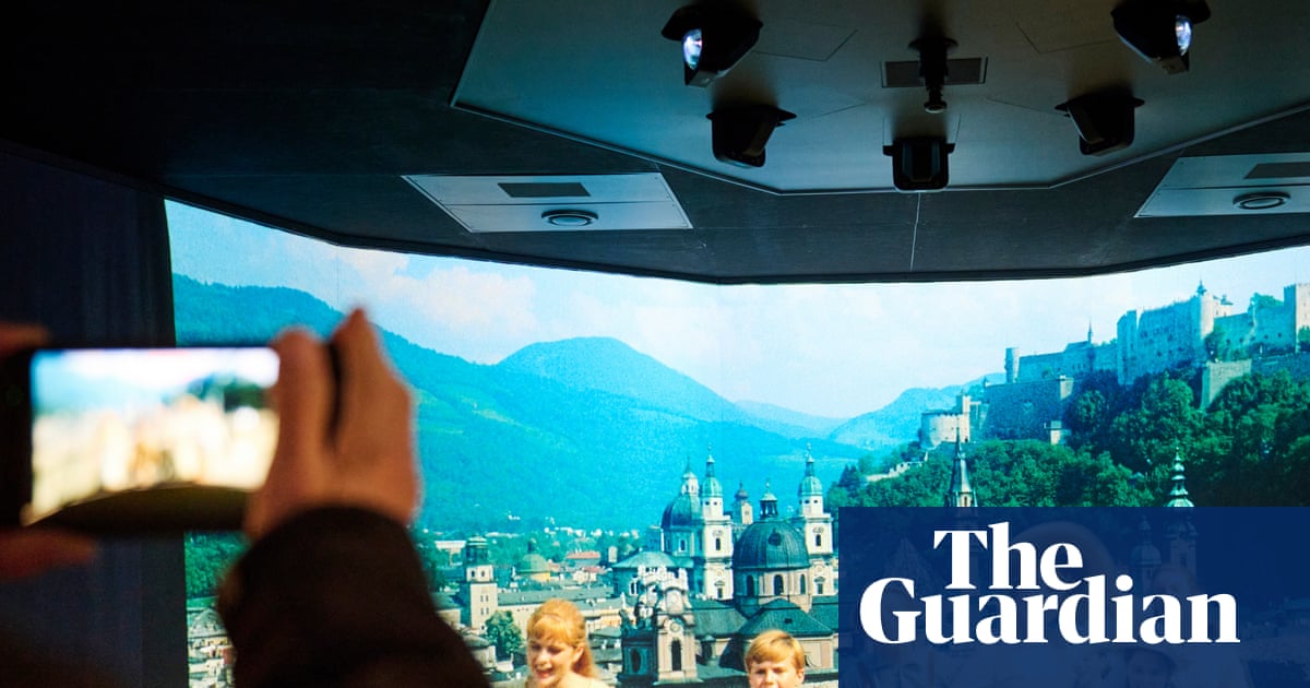 Interior of the new Sound of Music museum in Salzburg with exhibits and a view of the city.