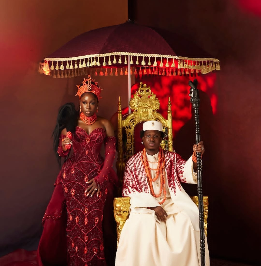 Elegant older couple arriving at a Lagos wedding in stylish attire