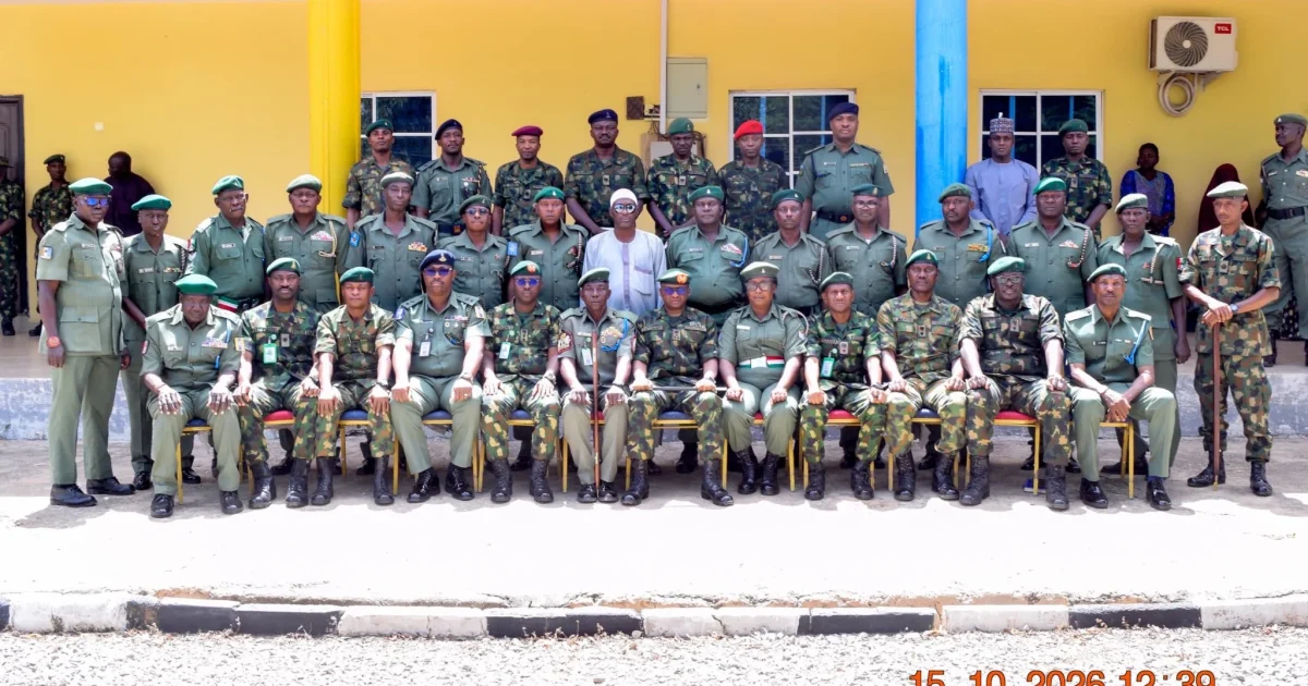 Nigerian soldiers in dress uniform receiving medals during a ceremony