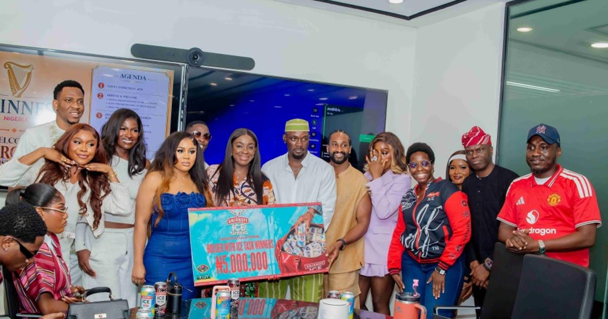 Crowd celebrating with confetti at Guinness Nigeria headquarters during BBNaija 2026 winners event
