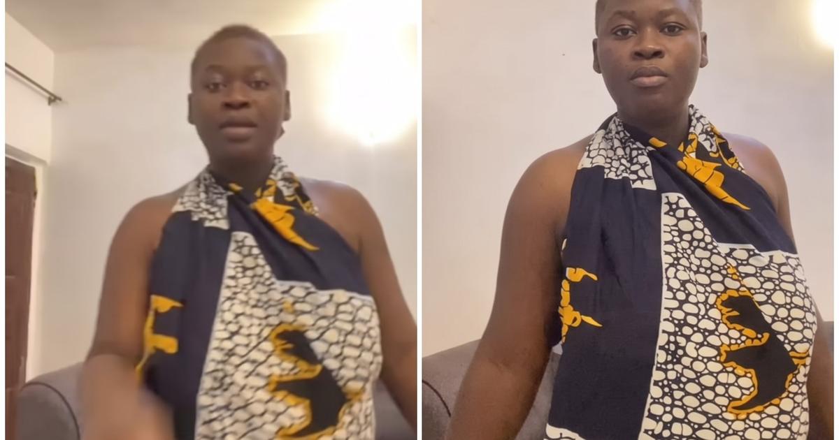 Nigerian woman contemplating DNA test results on her phone, symbolizing marital tension and personal dilemma