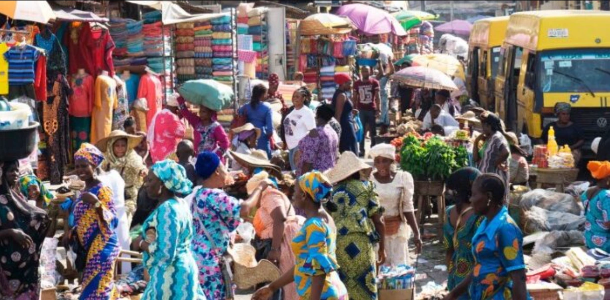 Lagos market scene showing everyday Nigerians navigating rising costs