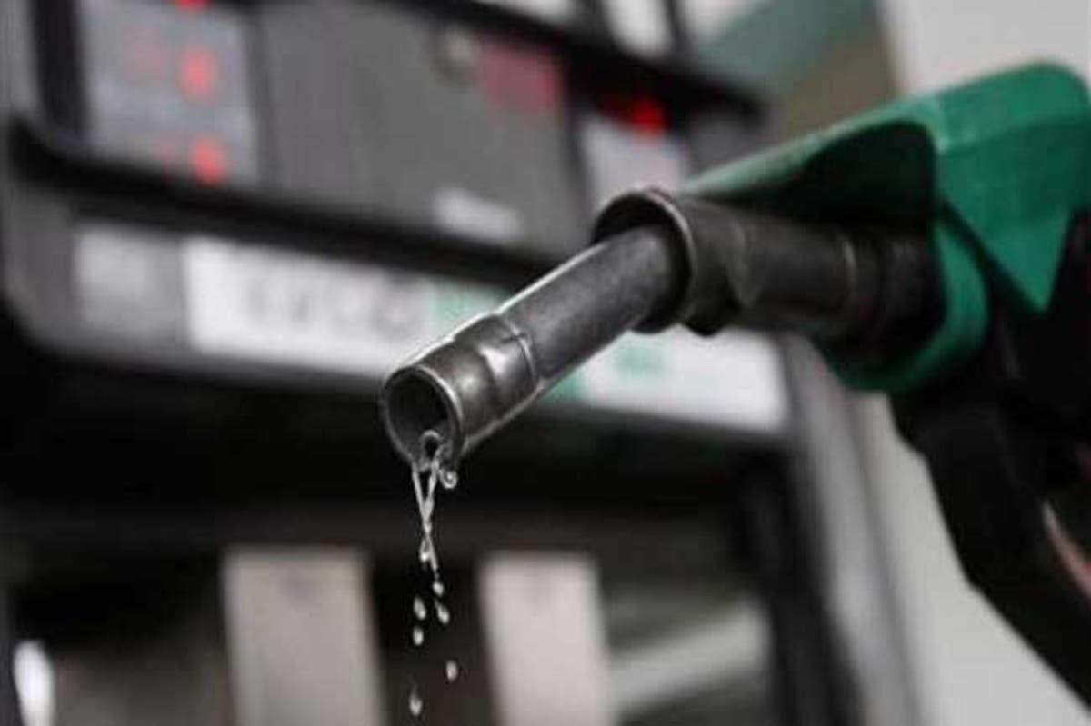 Busy Nigerian filling station with customers refueling vehicles amid new petrol pricing