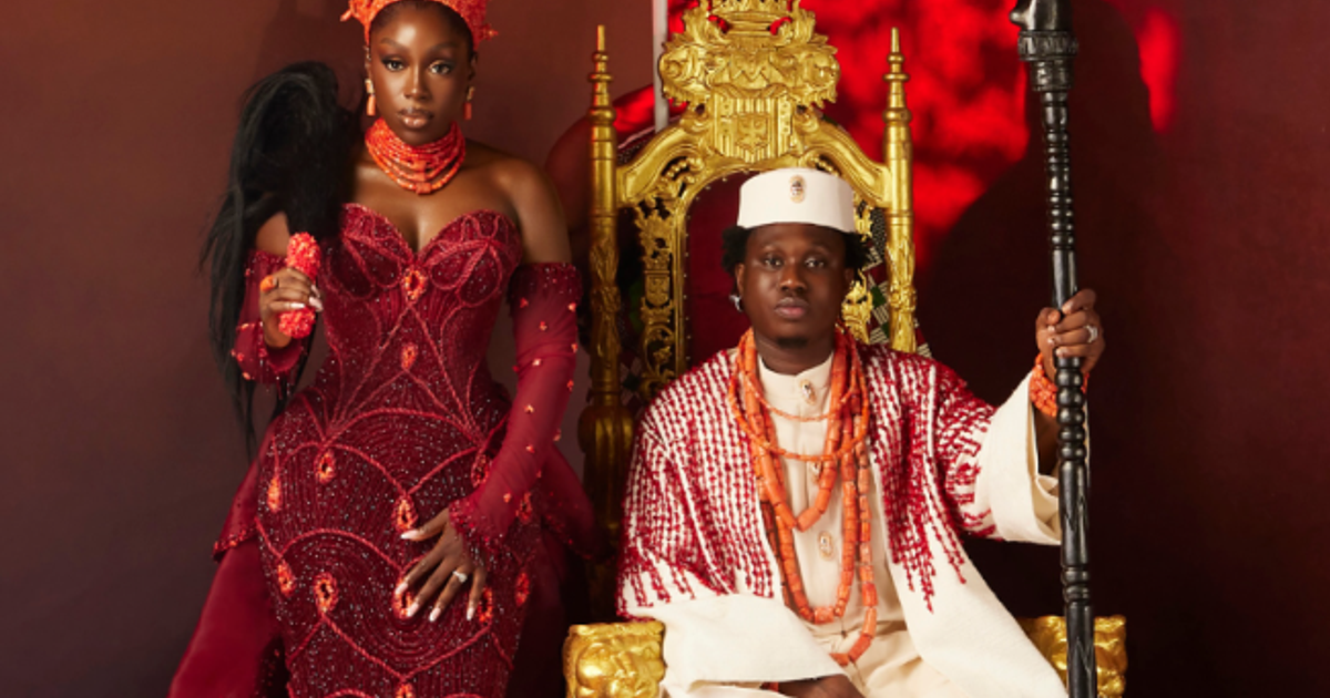 Group of Lagos celebrities in colourful traditional wedding attire at a night‑time event venue.