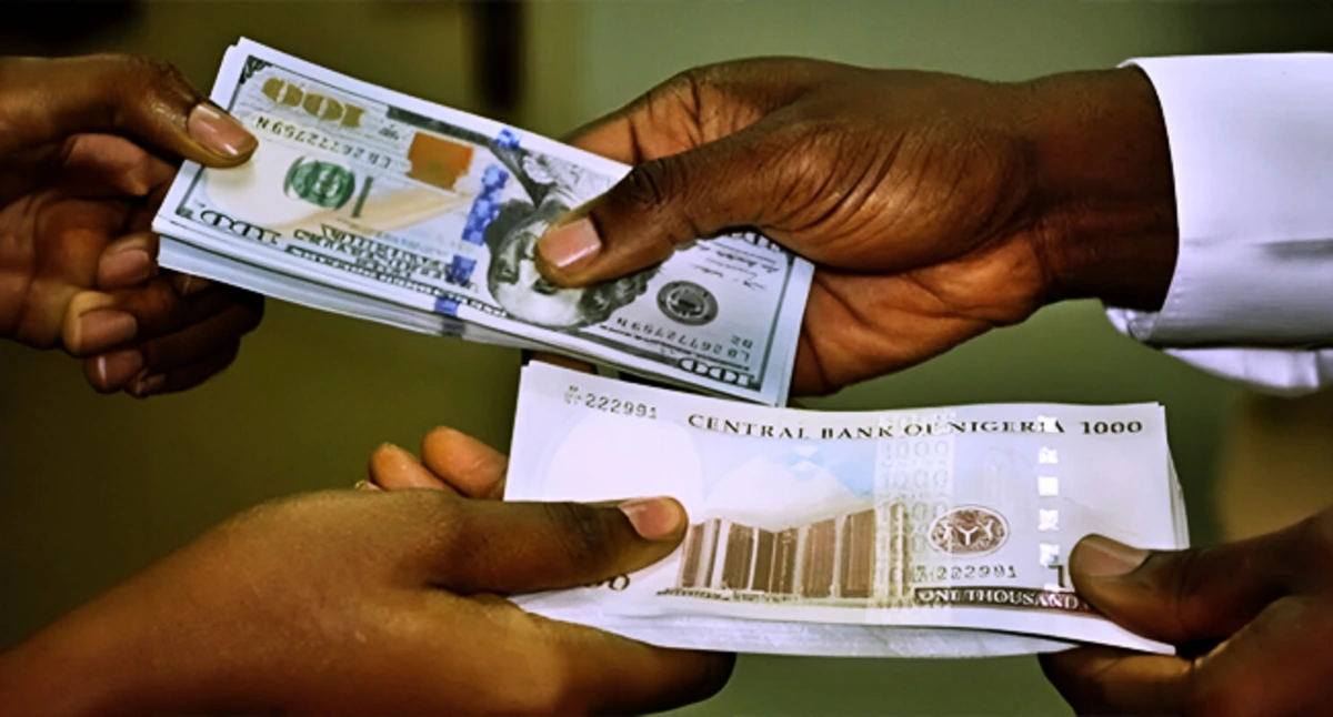 Nigerian bank customers transacting as digital screens show currency exchange rates