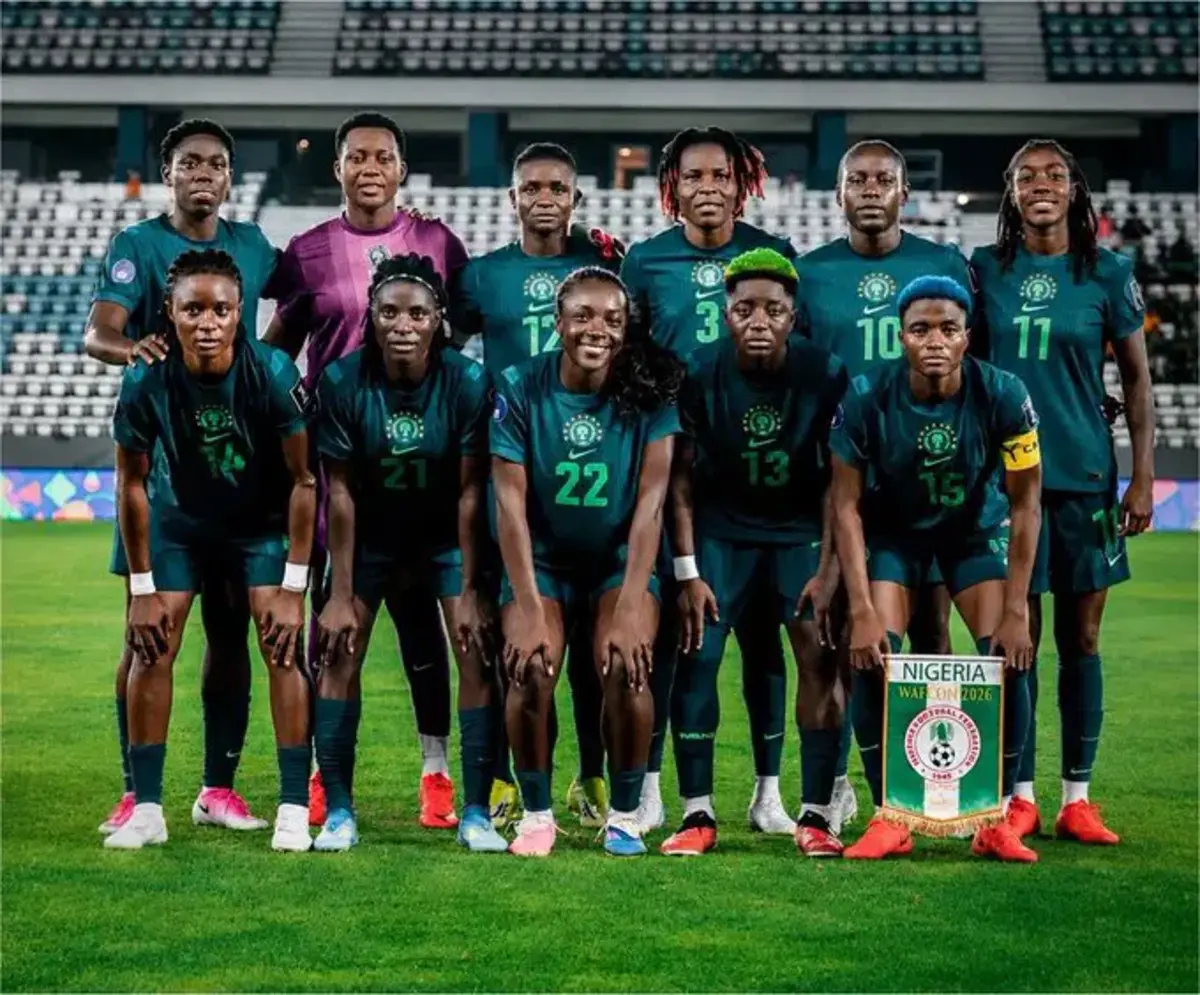 Empty Lagos stadium with a Nigerian women's football jersey on the goalpost, symbolising the Super Falcons funding loss.