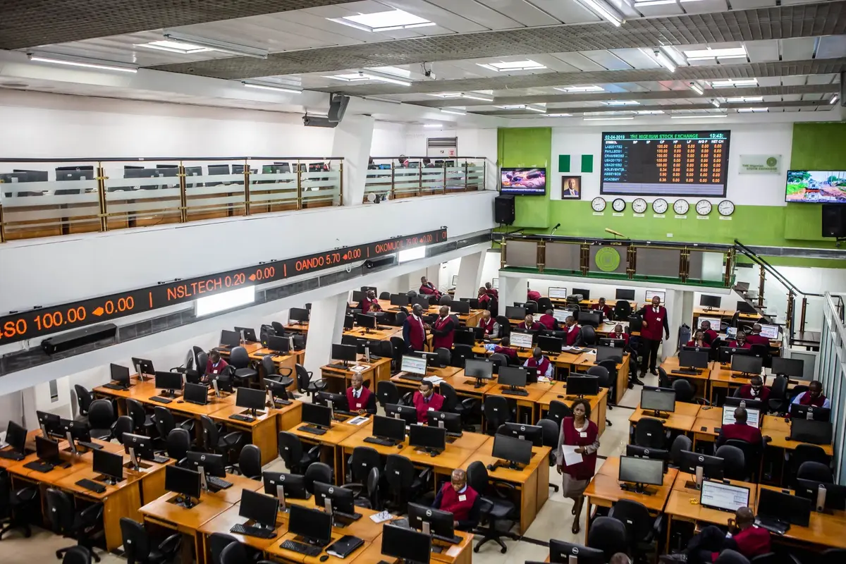 NGX trading floor with digital displays and Lagos skyline
