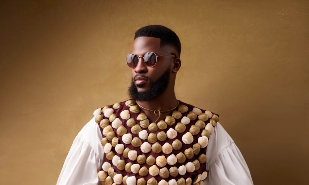 Models walking a Paris runway in contemporary Nigerian menswear designs.