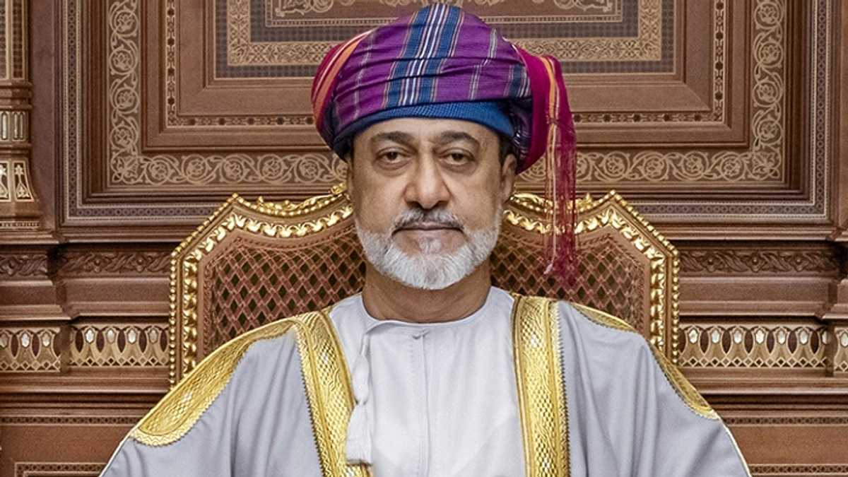 African business delegation reviewing opportunities at a bustling Omani port