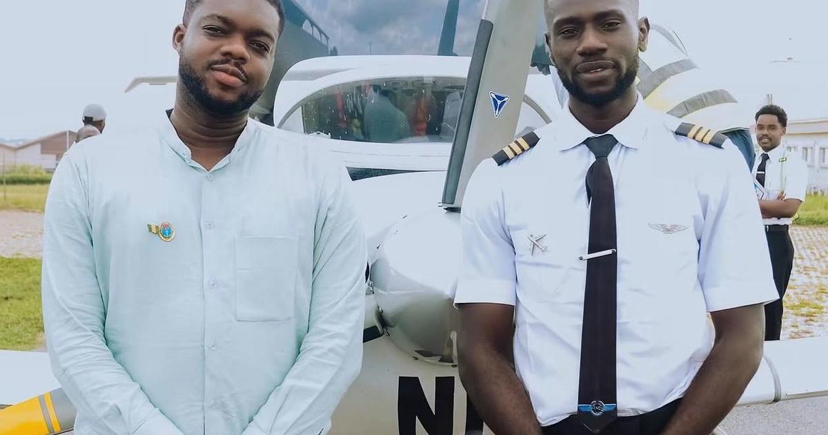 Drone flying over Lagos waterfront with a Nigerian engineer watching