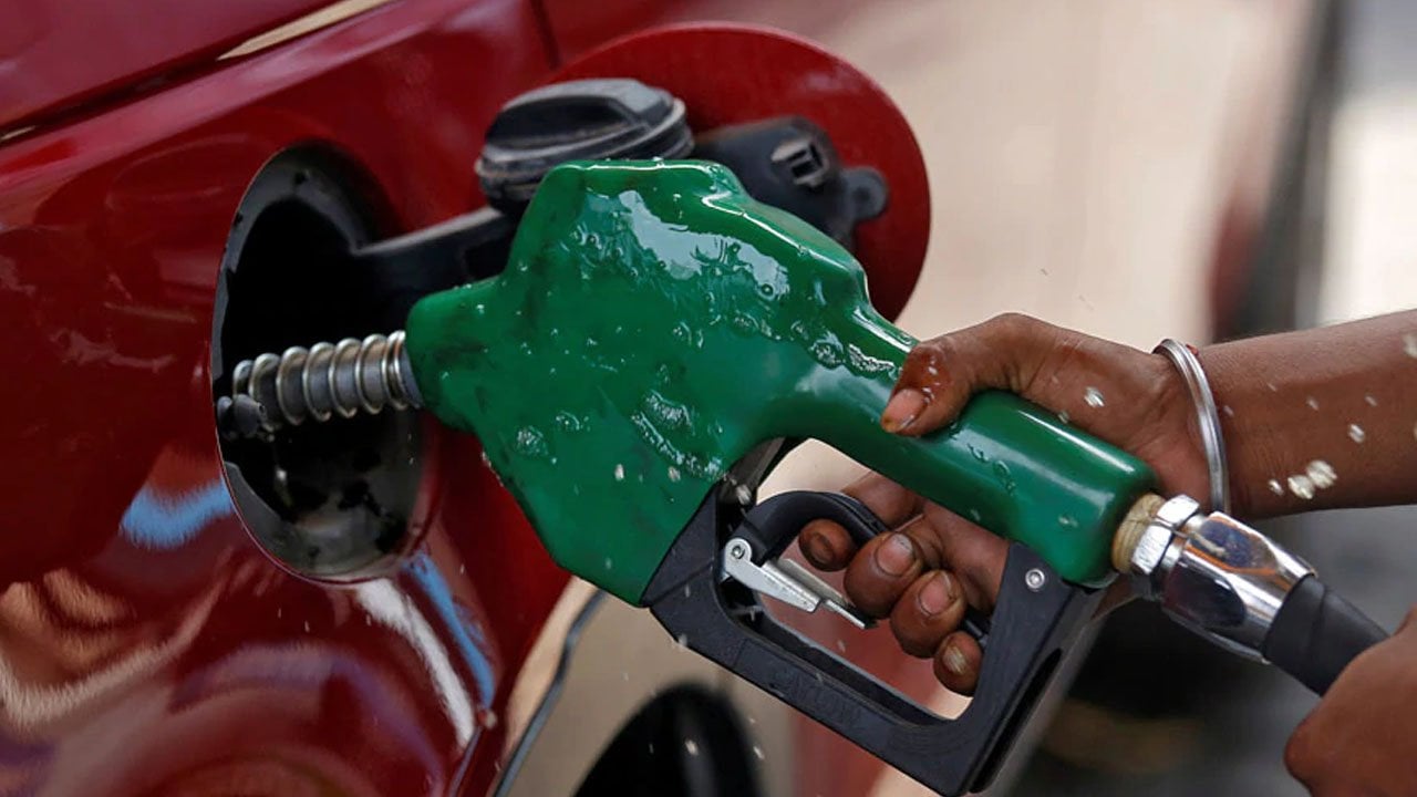 NNPCL fuel station with cars waiting for petrol on a sunny morning in Nigeria