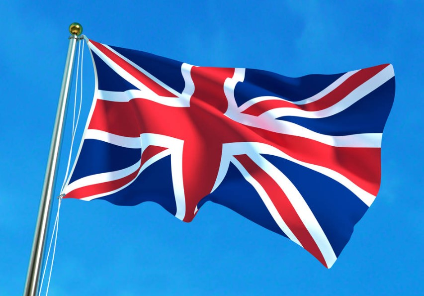 UK university campus with Nigerian flag and textbooks representing Nigerian students facing study visa challenges