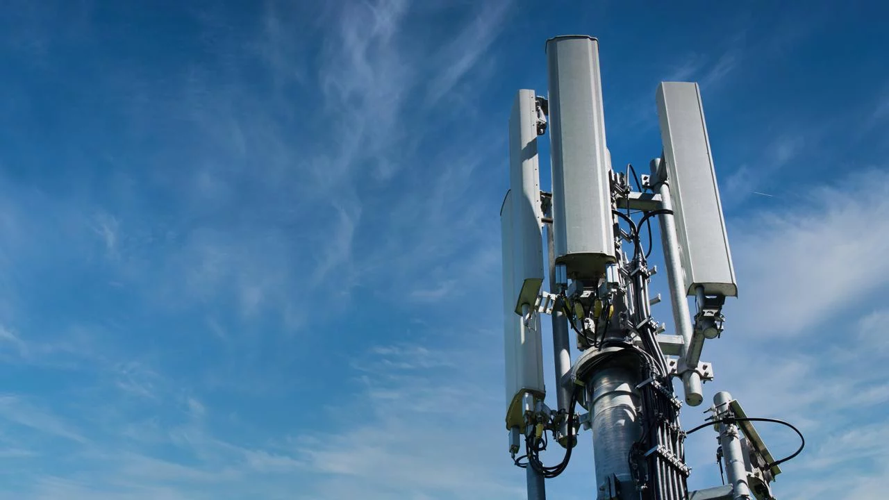 African city skyline with telecom towers and fiber optic cables representing digital growth