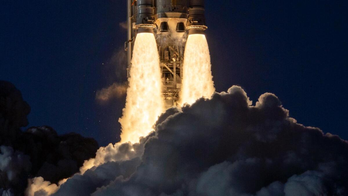 NASA lunar lander approaching the Moon with Earth in the distance