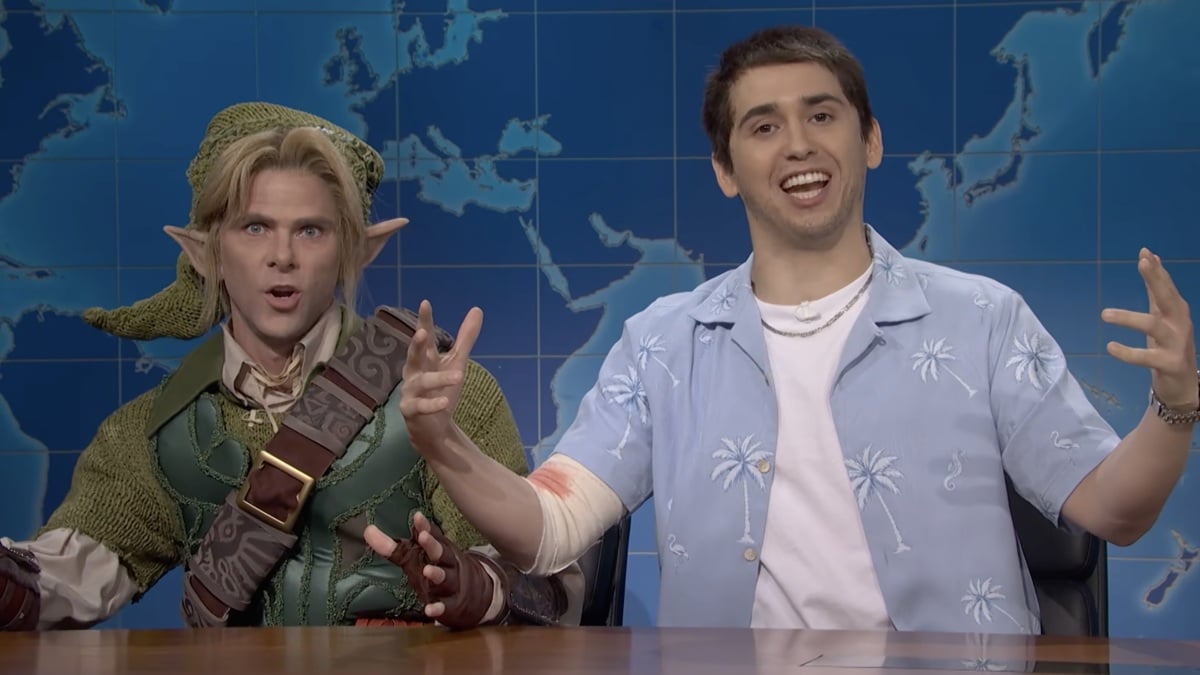 SNL Weekend Update set with silhouettes representing a video‑game character and a fantasy hero.