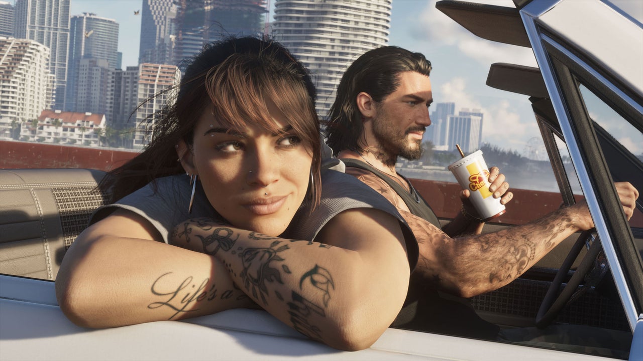 Empty office desks with gaming monitors suggesting workers took time off for Grand Theft Auto VI