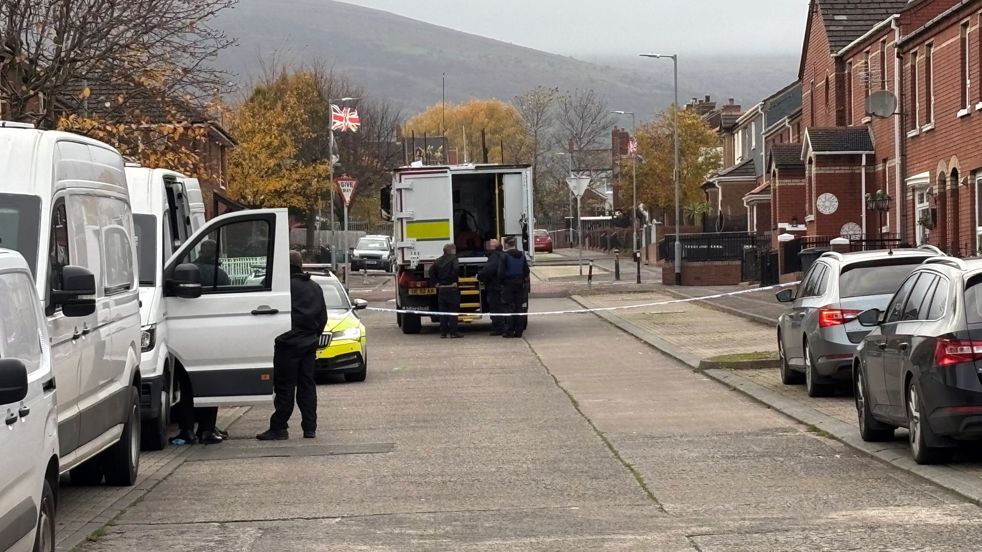 Shankill Road area in Belfast with police cordon visible in background