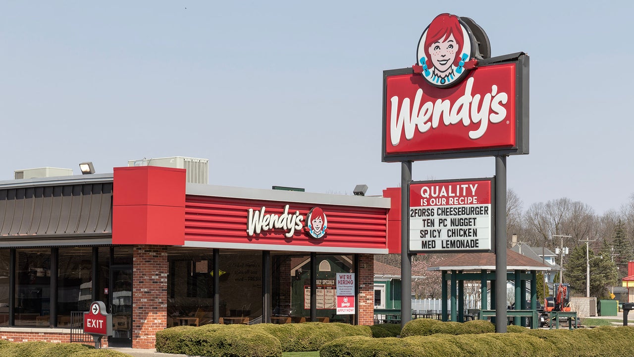 Wendy's restaurant with a closed sign, indicating a potential store closure.