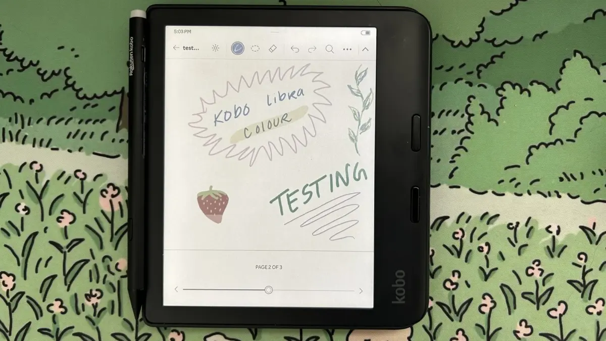 Modern color e-reader device displayed on a minimalist desk with vibrant display showing various colors